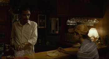 Movie still from “600 Miles” (2015), directed by Gabriel Ripstein – A man and a woman sitting at a bar; Medium shot, Over the shoulder angle