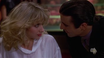 Movie still from “8 Million Ways to Die” (1986), directed by Hal Ashby – A man and a woman looking at one another; Close Up shot, Over the shoulder angle