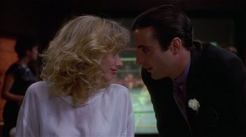 Movie still from “8 Million Ways to Die” (1986), directed by Hal Ashby – A man and a woman talking to each other; Close Up shot, Low angle