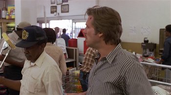 A group of people standing around in a room