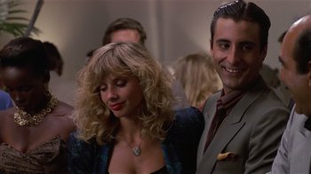 Movie still from “8 Million Ways to Die” (1986), directed by Hal Ashby – A man and a woman standing next to each other; Close Up shot, Over the shoulder angle