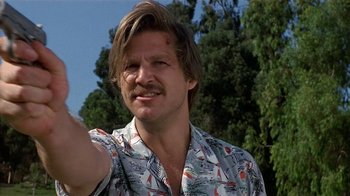 Movie still from “8 Million Ways to Die” (1986), directed by Hal Ashby – A person wearing a hawaiian shirt; Close Up shot, Low angle
