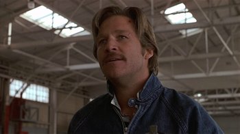 Movie still from “8 Million Ways to Die” (1986), directed by Hal Ashby – A person with long hair; Close Up shot, Low angle