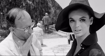 Movie still from “8½” (1963), directed by Federico Fellini – A man and a woman wearing hats and glasses; Close Up shot, Over the shoulder angle