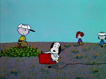 Movie still from “A Boy Named Charlie Brown” (1969), directed by Bill Melendez – A painting of a dog pulling a cart with a girl on it; Extreme Wide shot, High angle