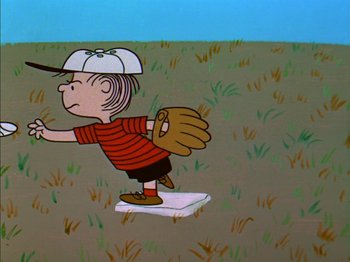 Movie still from “A Boy Named Charlie Brown” (1969), directed by Bill Melendez – Charlie brown is playing baseball in a field; Extreme Wide shot, Overhead angle