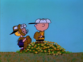 Movie still from “A Boy Named Charlie Brown” (1969), directed by Bill Melendez – A charlie brown and a charlie brown baseball player in a field of flowers; Extreme Wide shot, Low angle