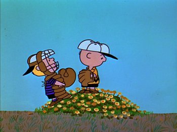 Movie still from “A Boy Named Charlie Brown” (1969), directed by Bill Melendez – A couple of people that are standing in the grass; Extreme Wide shot, Low angle