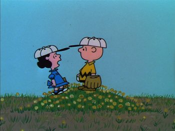 Movie still from “A Boy Named Charlie Brown” (1969), directed by Bill Melendez – A couple of cartoon characters are standing in a field; Medium shot, Overhead angle