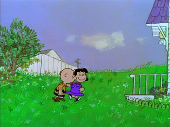 Movie still from “A Boy Named Charlie Brown” (1969), directed by Bill Melendez – A charlie brown and a peanuts character kissing in a field; Extreme Wide shot, High angle