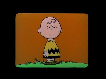 Movie still from “A Boy Named Charlie Brown” (1969), directed by Bill Melendez – A charlie brown character is shown in a cartoon; Medium shot, High angle
