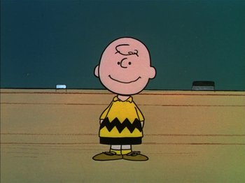 Movie still from “A Boy Named Charlie Brown” (1969), directed by Bill Melendez – A charlie brown character is shown in a cartoon; Medium shot, High angle