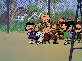 Movie still from “A Boy Named Charlie Brown” (1969), directed by Bill Melendez – A group of people standing next to each other in front of a chain link fence; Extreme Wide shot, Low angle