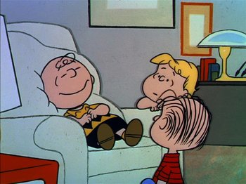 Movie still from “A Boy Named Charlie Brown” (1969), directed by Bill Melendez – A charlie brown and the peanuts gang sitting on a couch; Wide shot, High angle
