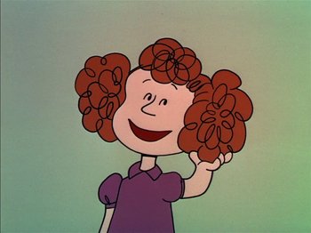 Movie still from “A Boy Named Charlie Brown” (1969), directed by Bill Melendez – A drawing of a girl with red curly hair and a purple shirt; Close Up shot, High angle