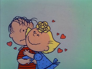 Movie still from “A Boy Named Charlie Brown” (1969), directed by Bill Melendez – A drawing of a boy and a girl kissing; Medium shot, High angle