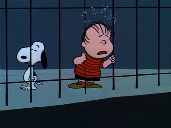Movie still from “A Boy Named Charlie Brown” (1969), directed by Bill Melendez – A charlie brown and a dog in a jail cell; Medium shot, Low angle
