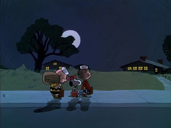 Movie still from “A Boy Named Charlie Brown” (1969), directed by Bill Melendez – A couple of people standing next to each other on a sidewalk; Extreme Wide shot, Low angle
