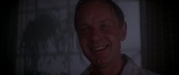 Movie still from “A Bridge Too Far” (1977), directed by Richard Attenborough – A person smiling for the camera; Close Up shot, Low angle