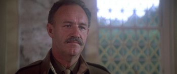 Movie still from “A Bridge Too Far” (1977), directed by Richard Attenborough – A person with a mustache; Close Up shot, Low angle