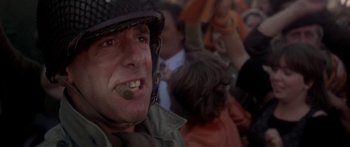 Movie still from “A Bridge Too Far” (1977), directed by Richard Attenborough – A person wearing a helmet; Close Up shot, Low angle