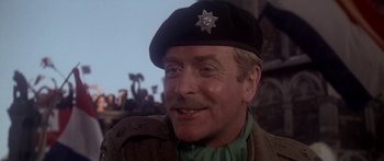 Movie still from “A Bridge Too Far” (1977), directed by Richard Attenborough – A person wearing a hat; Close Up shot, Low angle