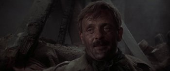 Movie still from “A Bridge Too Far” (1977), directed by Richard Attenborough – A person with a mustache; Close Up shot, Low angle