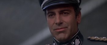 Movie still from “A Bridge Too Far” (1977), directed by Richard Attenborough – A person wearing a uniform; Close Up shot, Low angle