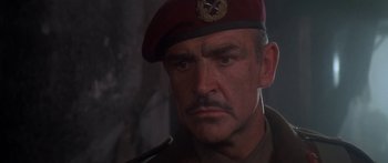 Movie still from “A Bridge Too Far” (1977), directed by Richard Attenborough – A person wearing a hat; Close Up shot, Low angle