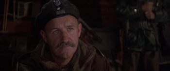 Movie still from “A Bridge Too Far” (1977), directed by Richard Attenborough – A person wearing a hat; Close Up shot, Low angle