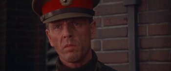 Movie still from “A Bridge Too Far” (1977), directed by Richard Attenborough – A person wearing a hat; Close Up shot, Low angle