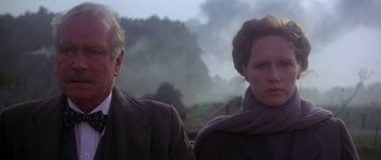 Movie still from “A Bridge Too Far” (1977), directed by Richard Attenborough – A man and a woman standing next to each other; Close Up shot, Low angle