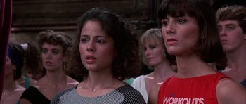 Movie still from “A Chorus Line” (1985), directed by Richard Attenborough – A group of women standing next to each other in a room; Close Up shot, Low angle