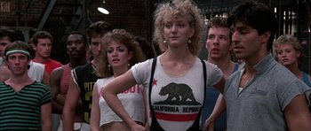 Movie still from “A Chorus Line” (1985), directed by Richard Attenborough – A group of people standing in front of each other; Medium shot, Low angle