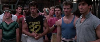 Movie still from “A Chorus Line” (1985), directed by Richard Attenborough – A group of young men standing next to each other; Medium shot, Low angle