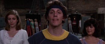 Movie still from “A Chorus Line” (1985), directed by Richard Attenborough – A person wearing a headband; Close Up shot, Low angle