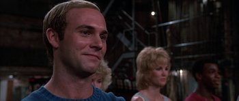 Movie still from “A Chorus Line” (1985), directed by Richard Attenborough – A person in a crowd of people; Close Up shot, Low angle