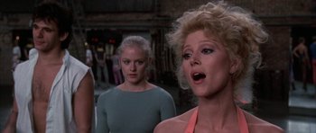 Movie still from “A Chorus Line” (1985), directed by Richard Attenborough – A group of women standing next to each other in a room; Close Up shot, Over the shoulder angle