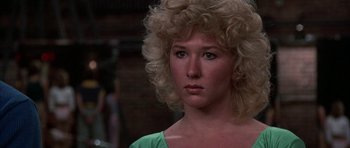 Movie still from “A Chorus Line” (1985), directed by Richard Attenborough – A person with blonde hair; Close Up shot, Low angle