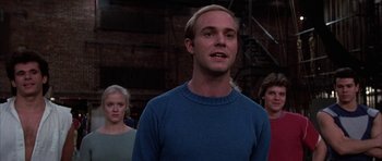 Movie still from “A Chorus Line” (1985), directed by Richard Attenborough – A group of people standing in front of a fire escape; Close Up shot, Low angle