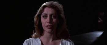 Movie still from “A Chorus Line” (1985), directed by Richard Attenborough – A person wearing a white shirt; Close Up shot, Low angle