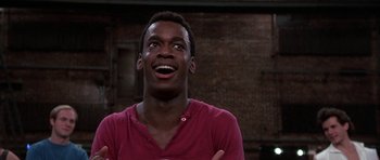 Movie still from “A Chorus Line” (1985), directed by Richard Attenborough – A young man is looking up at the ceiling; Close Up shot, Over the shoulder angle