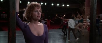 Movie still from “A Chorus Line” (1985), directed by Richard Attenborough – A group of people dancing in a dance studio; Medium shot, Low angle