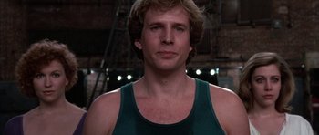 Movie still from “A Chorus Line” (1985), directed by Richard Attenborough – A person wearing a tank top; Close Up shot, Low angle