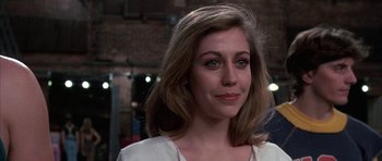 Movie still from “A Chorus Line” (1985), directed by Richard Attenborough – A person wearing a white shirt; Close Up shot, Over the shoulder angle