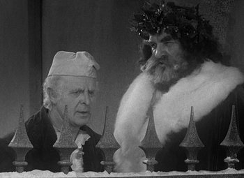 Movie still from “A Christmas Carol” (1938), directed by Edwin L. Marin – An old man and a man with a beard; Medium shot, Low angle