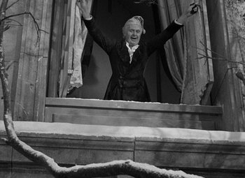 Movie still from “A Christmas Carol” (1938), directed by Edwin L. Marin – An old man standing in front of an open window; Medium shot, Low angle