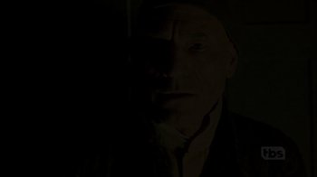 Movie still from “A Christmas Carol” (1999), directed by David Hugh Jones – A man in a dark room looking at the camera; Close Up shot, Low angle