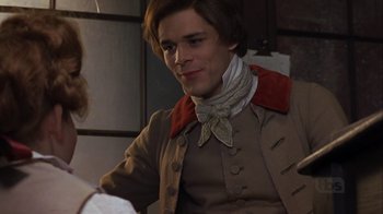 Movie still from “A Christmas Carol” (1999), directed by David Hugh Jones – A man in a brown jacket and a red neck tie; Medium shot, Over the shoulder angle