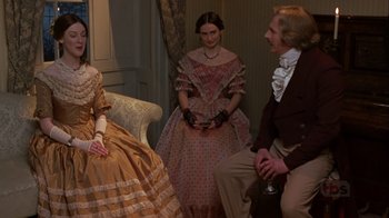 Movie still from “A Christmas Carol” (1999), directed by David Hugh Jones – A group of people dressed in period clothing; Medium shot, High angle